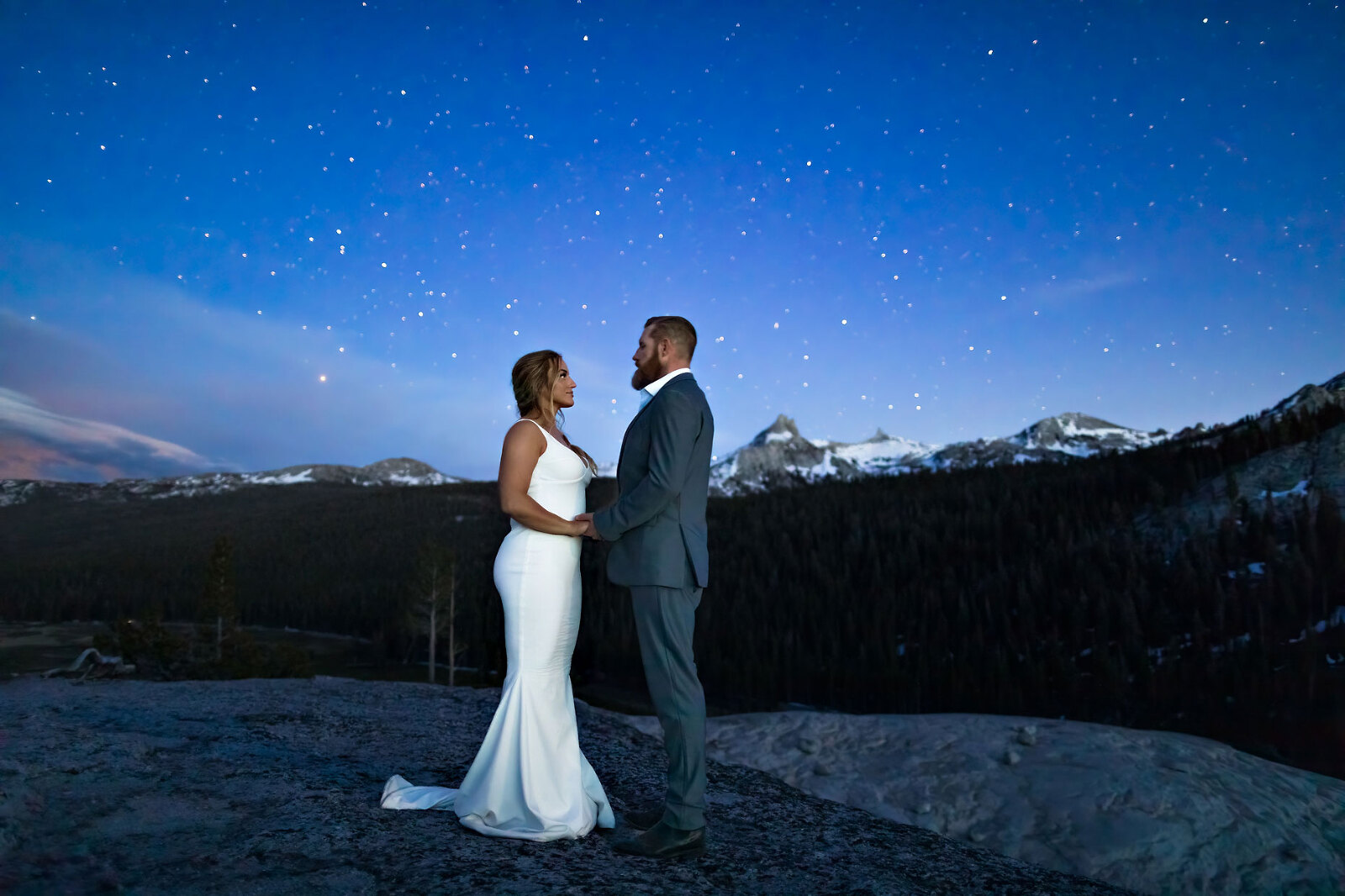 Wedding photo of bride and groom under the stars.