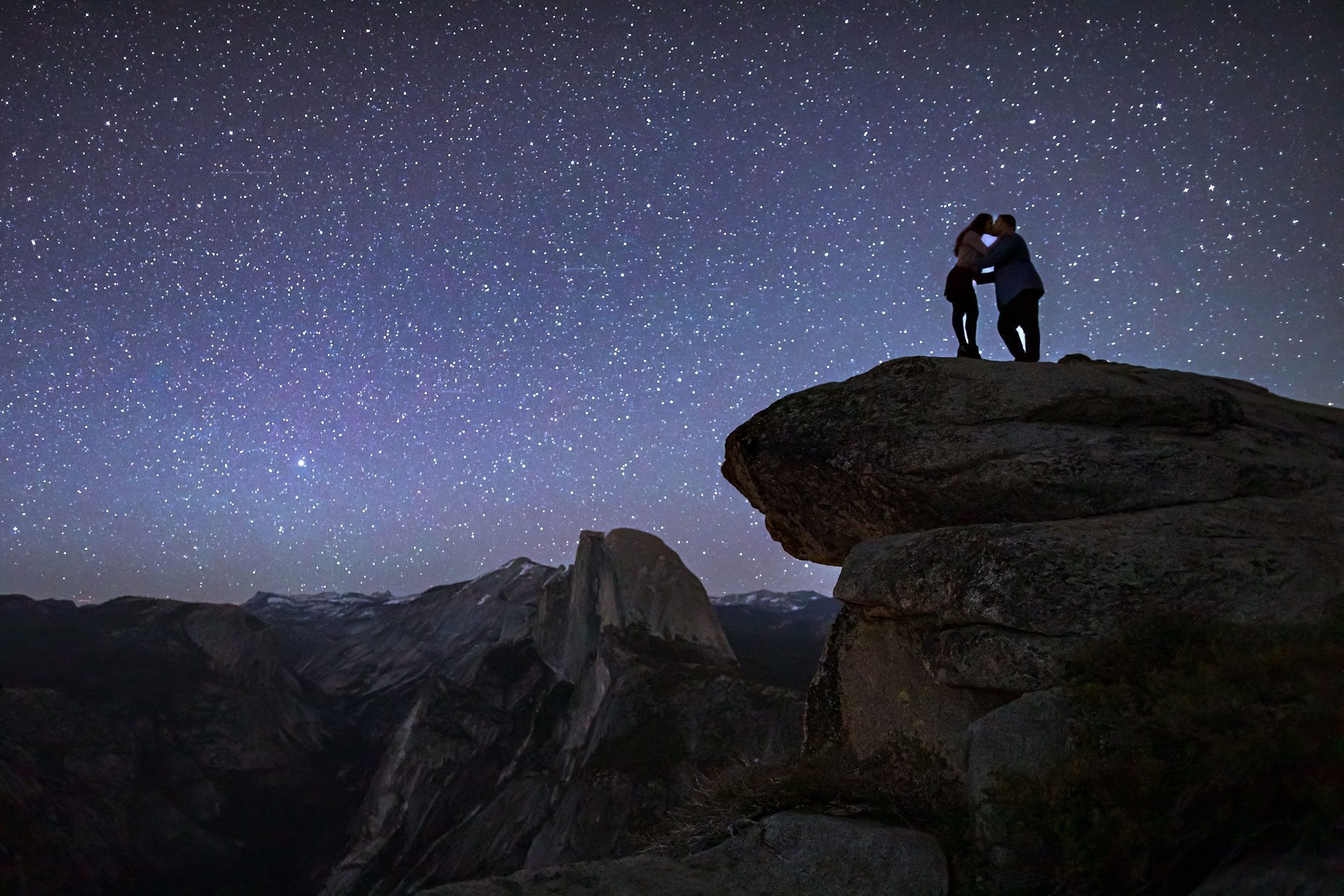 Elopement photo of bride and groom under the stars.