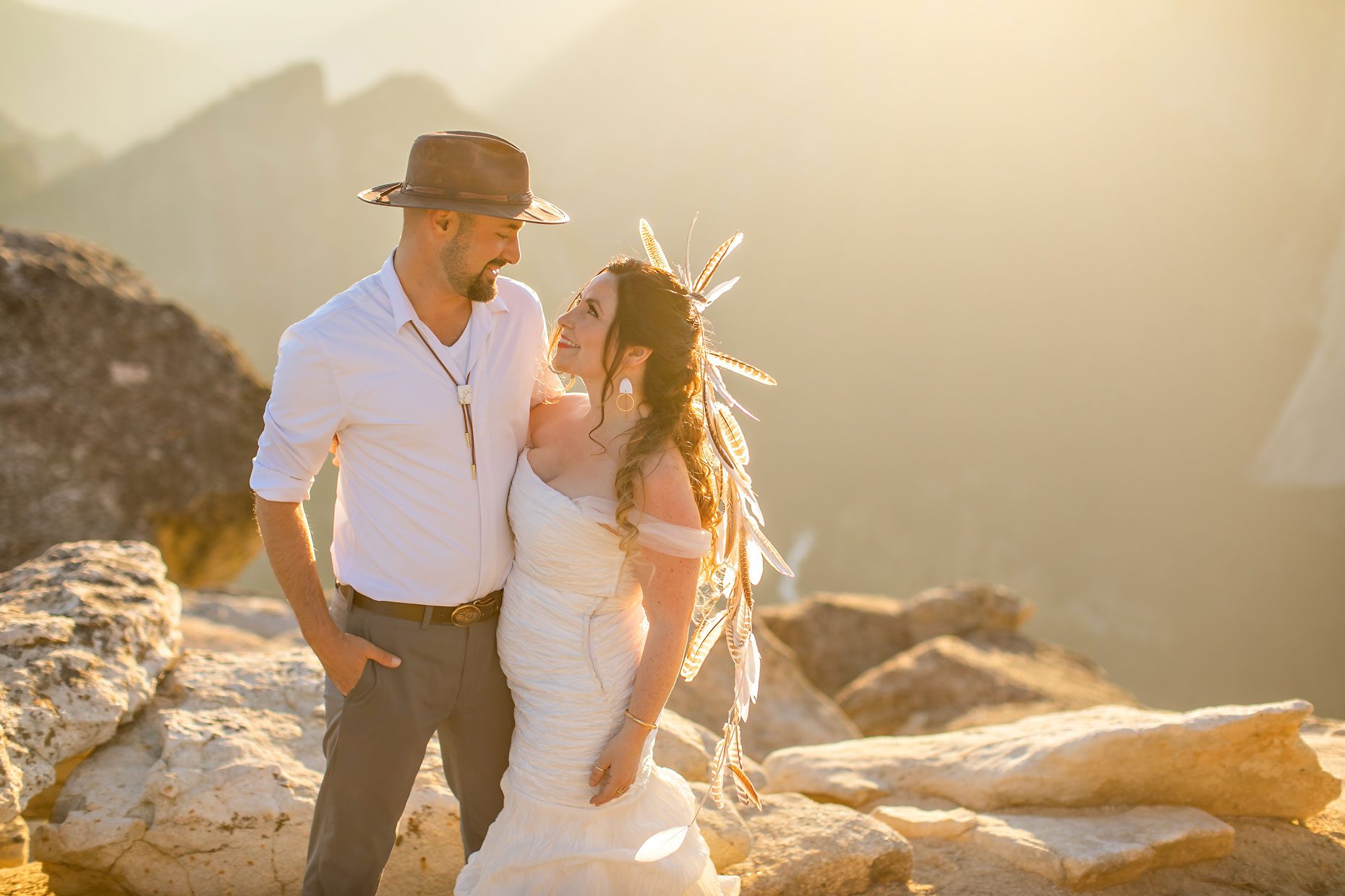 Couple gets wedding photography in Yosemite at Taft Point at sunset.