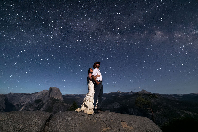 Couple gets wedding photography in Yosemite at Glacier Point under the stars.