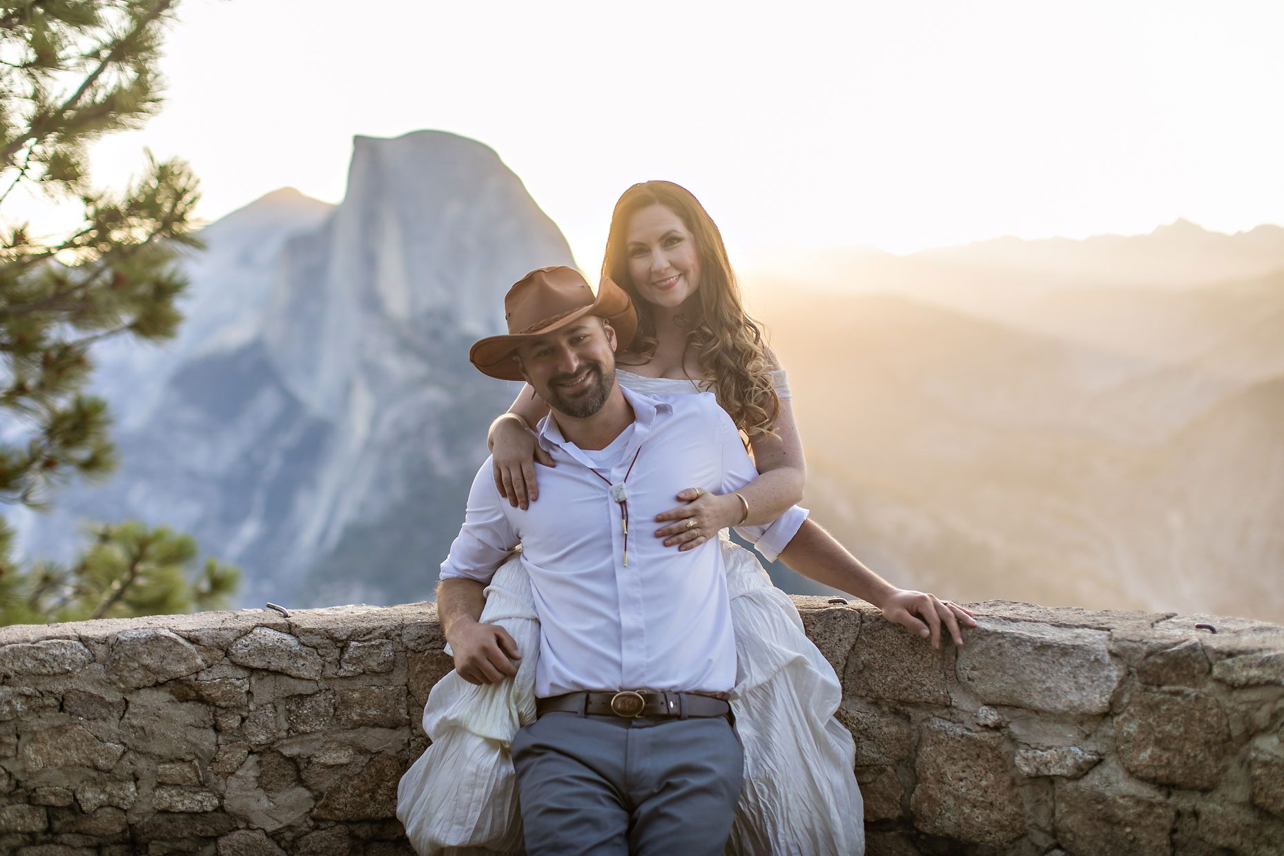 Couple gets wedding photography in Yosemite at Glacier Point at sunrise.