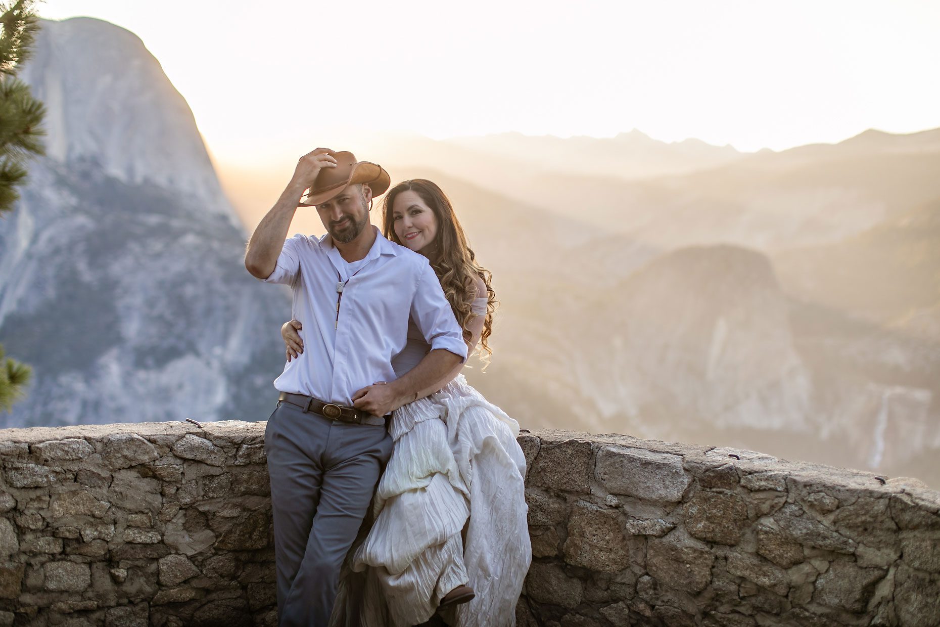 Couple gets wedding photography in Yosemite at Glacier Point at sunrise.