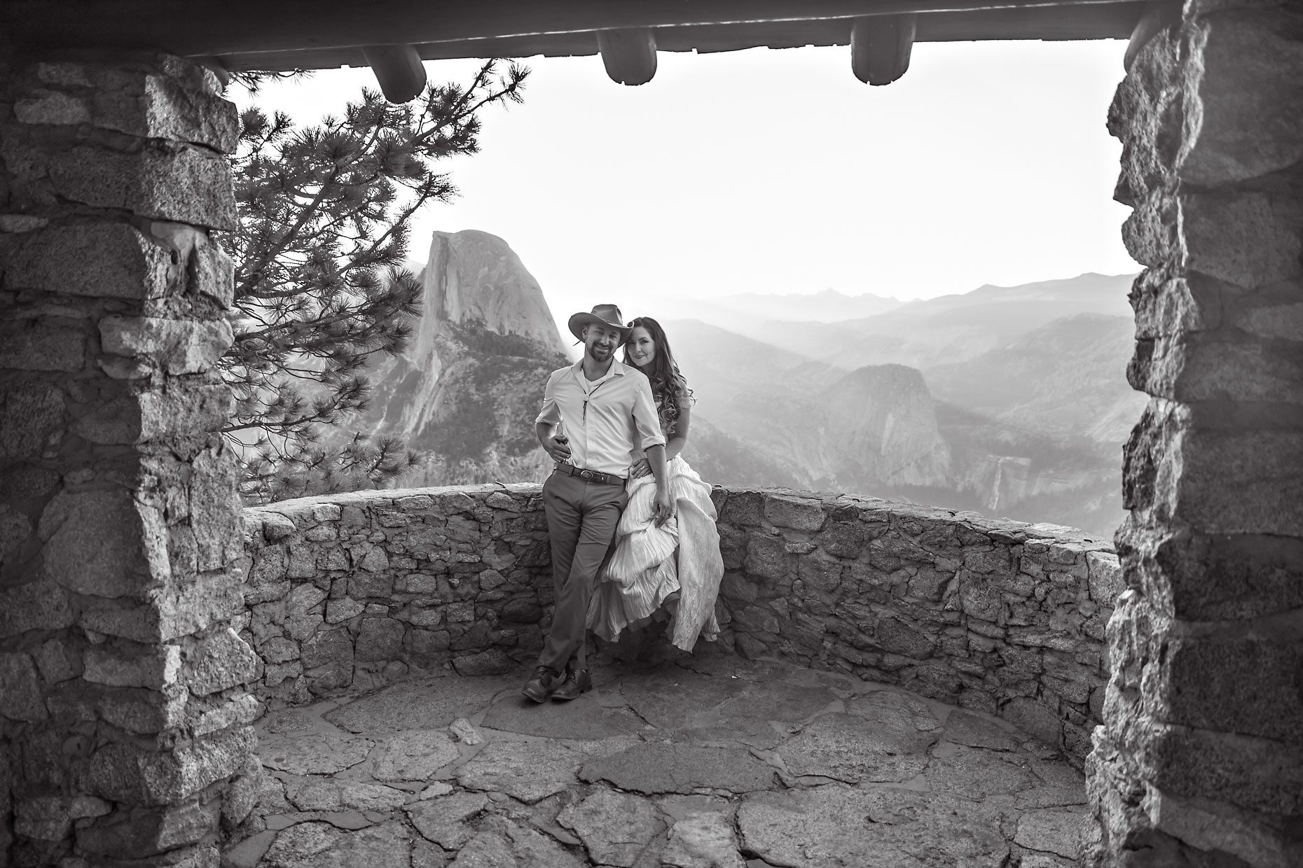 Couple gets wedding photography in Yosemite at Glacier Point at sunrise.