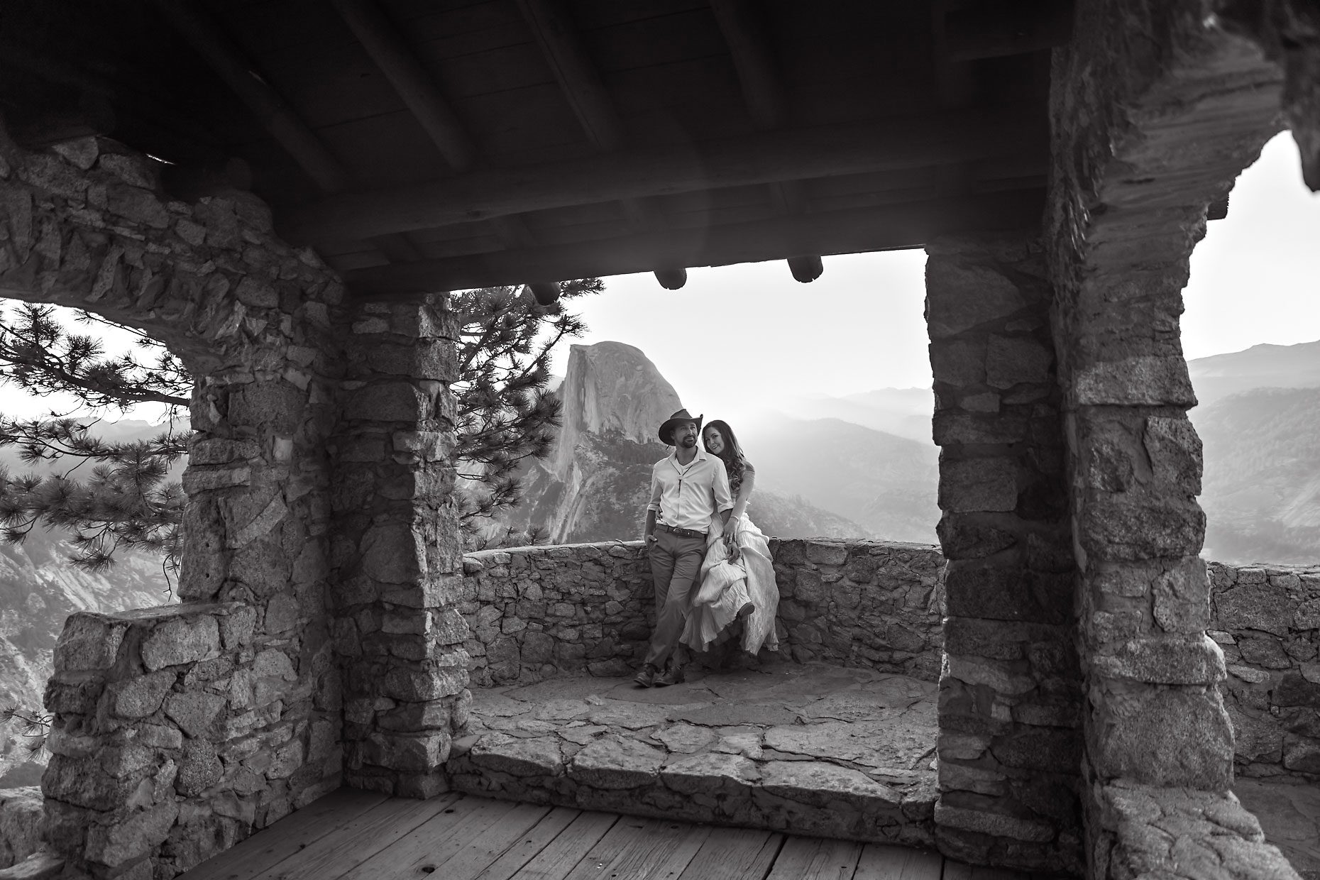 Couple gets wedding photography in Yosemite at Glacier Point at sunrise.