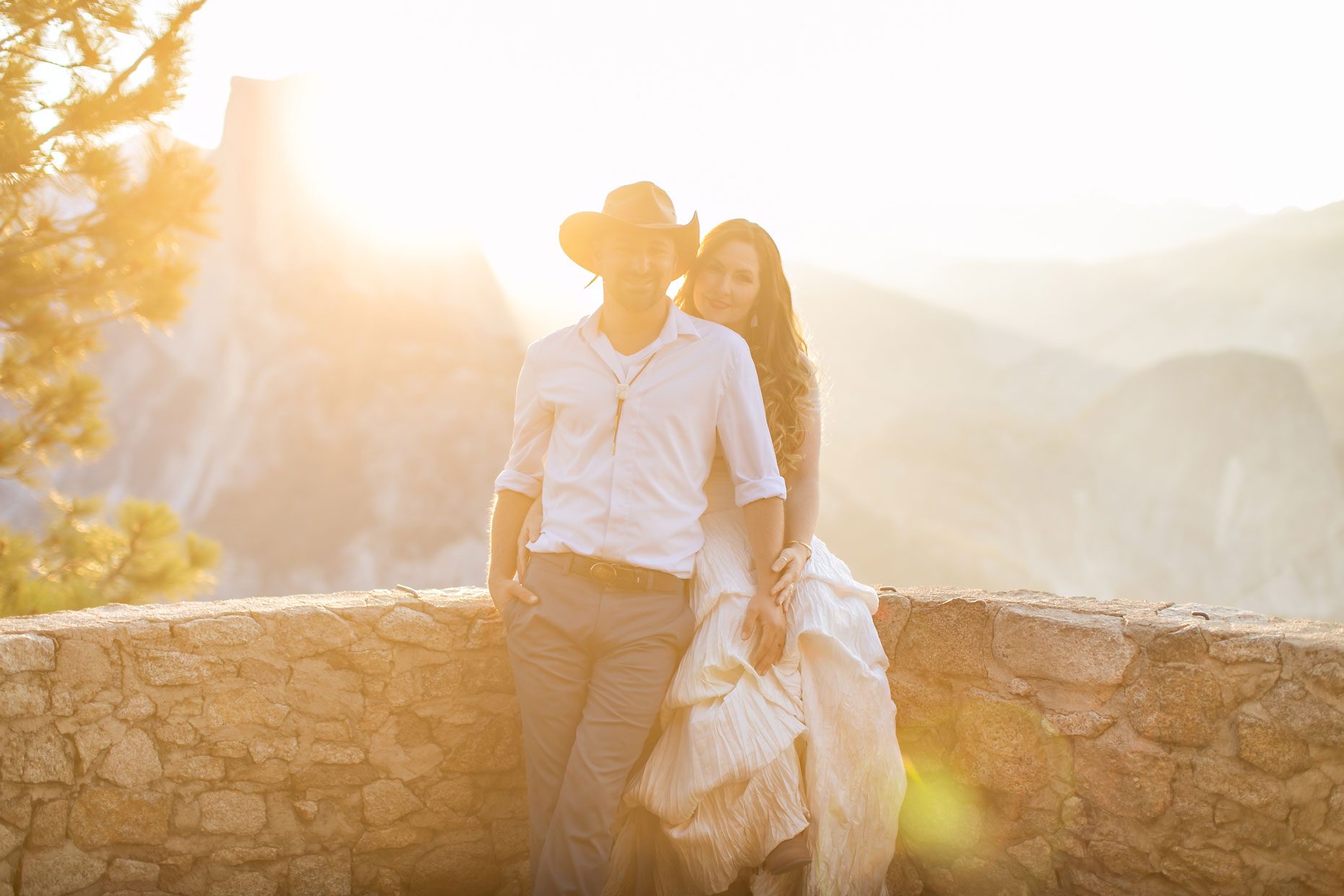 Couple gets wedding photography in Yosemite at Glacier Point at sunrise.