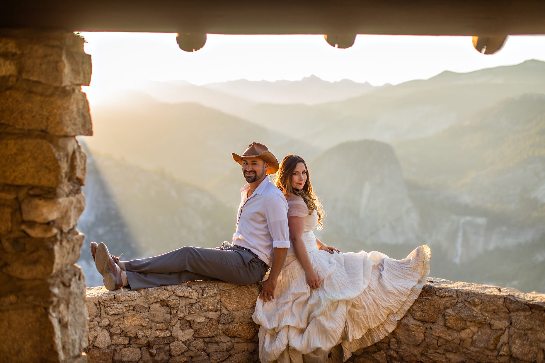 Couple gets wedding photography in Yosemite at Glacier Point at sunrise.