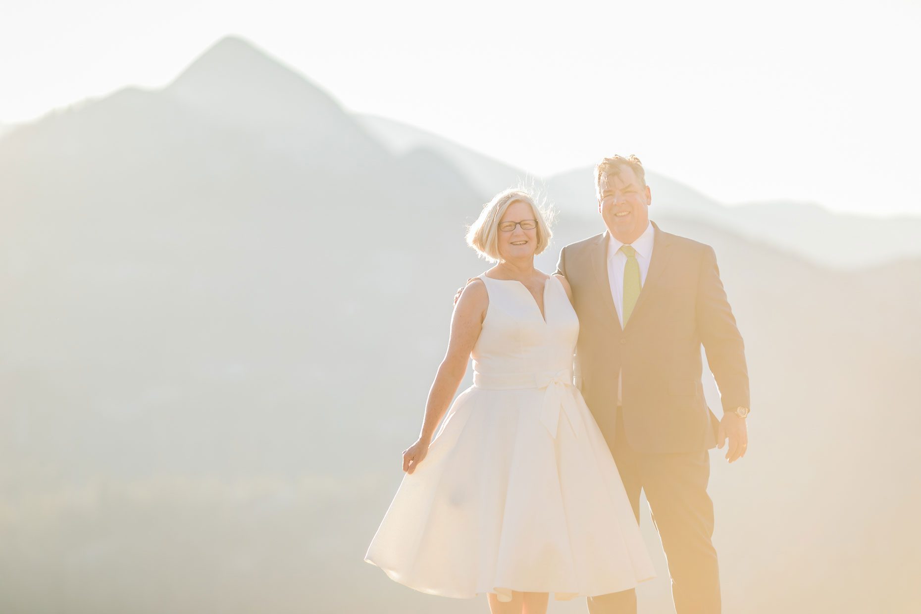 Couple gets wedding photography in Yosemite National Park at Glacier Point at sunrise.