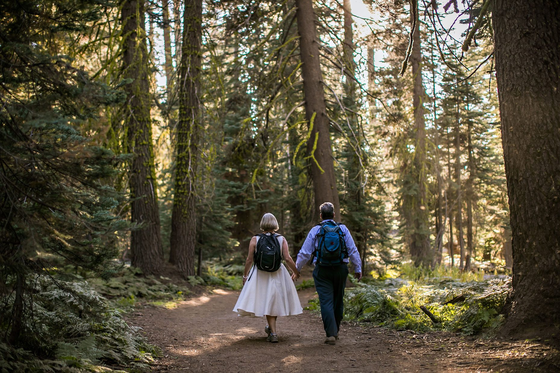 Wedding couple hikes out to Taft Point in Yosemite for adventure session photography.