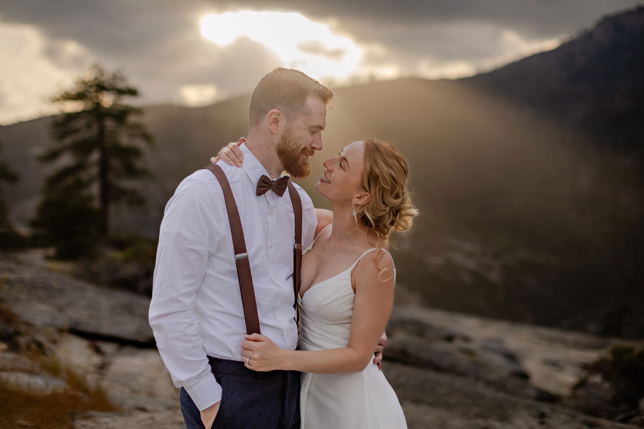 A wedding couple looking at each other.