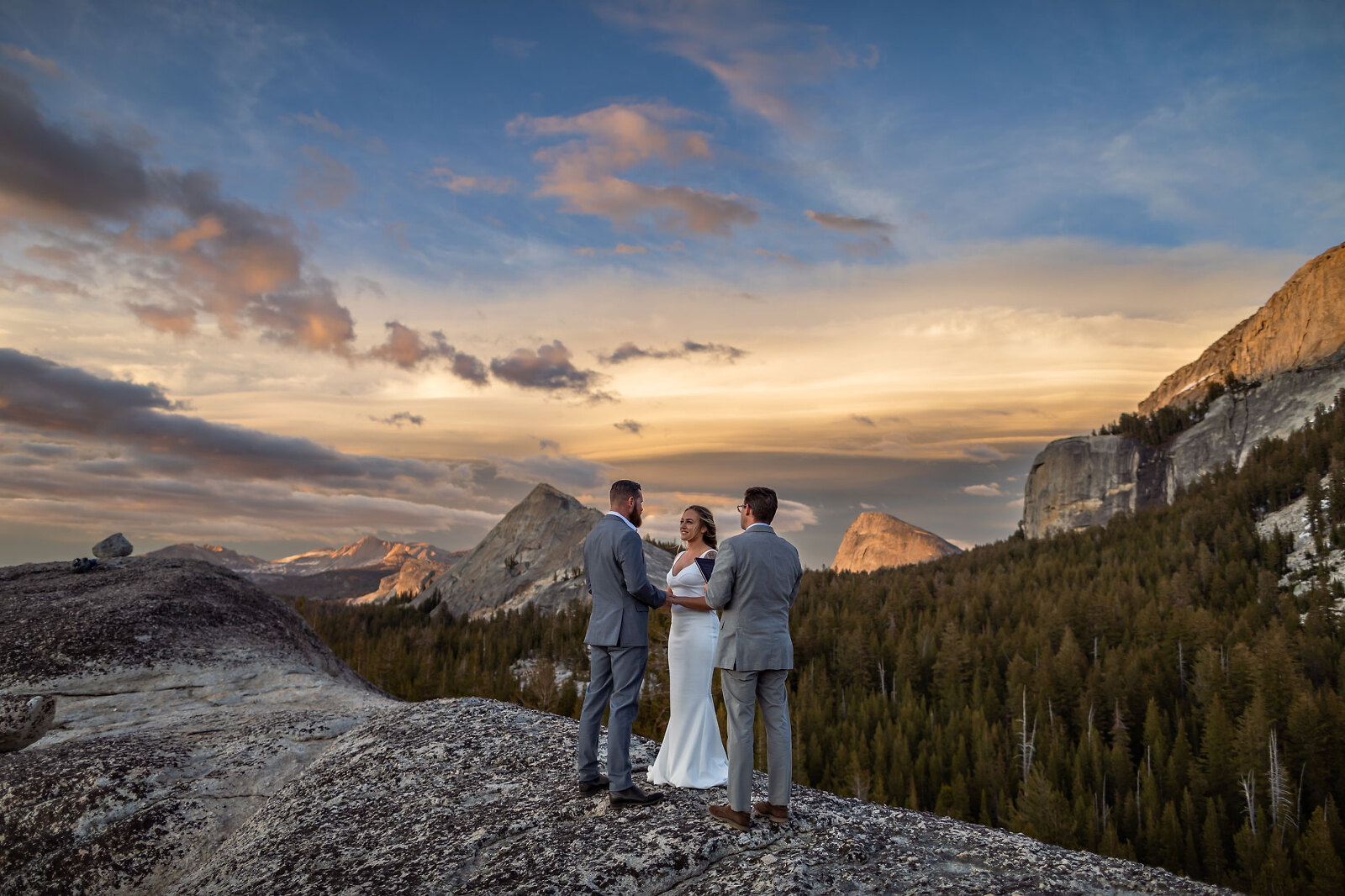 Elopement wedding ceremony in nature at sunset.