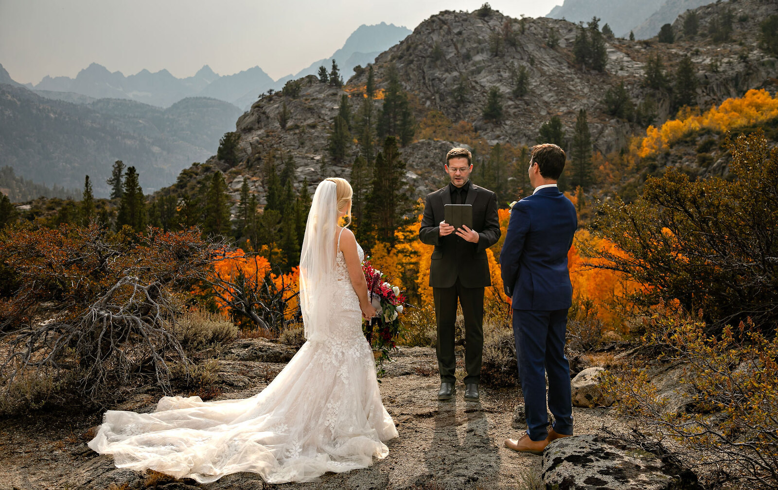 Mountain lake wedding ceremony during fall color