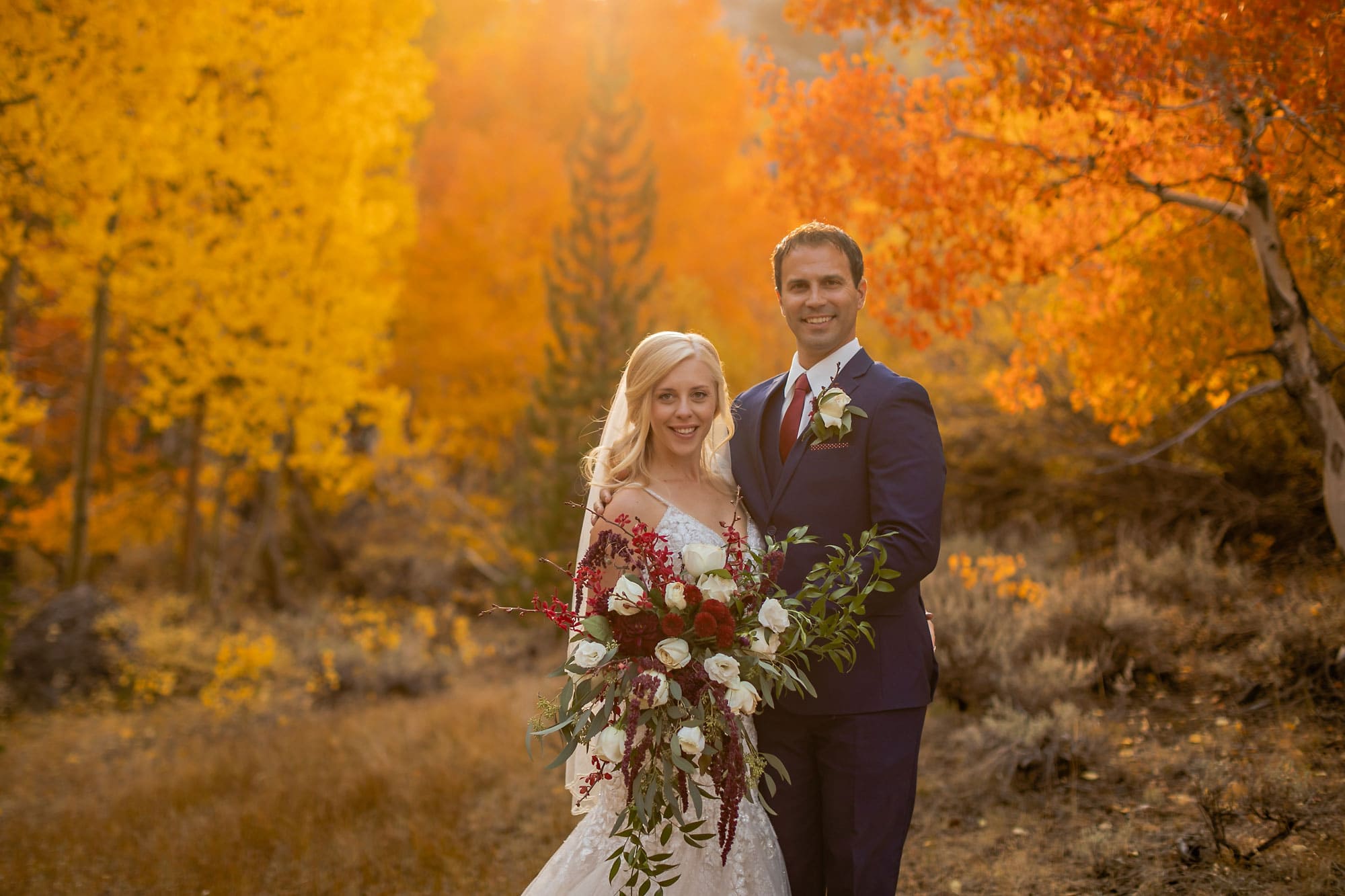 Bride and groom in fall colors in California's Eastern Sierra.