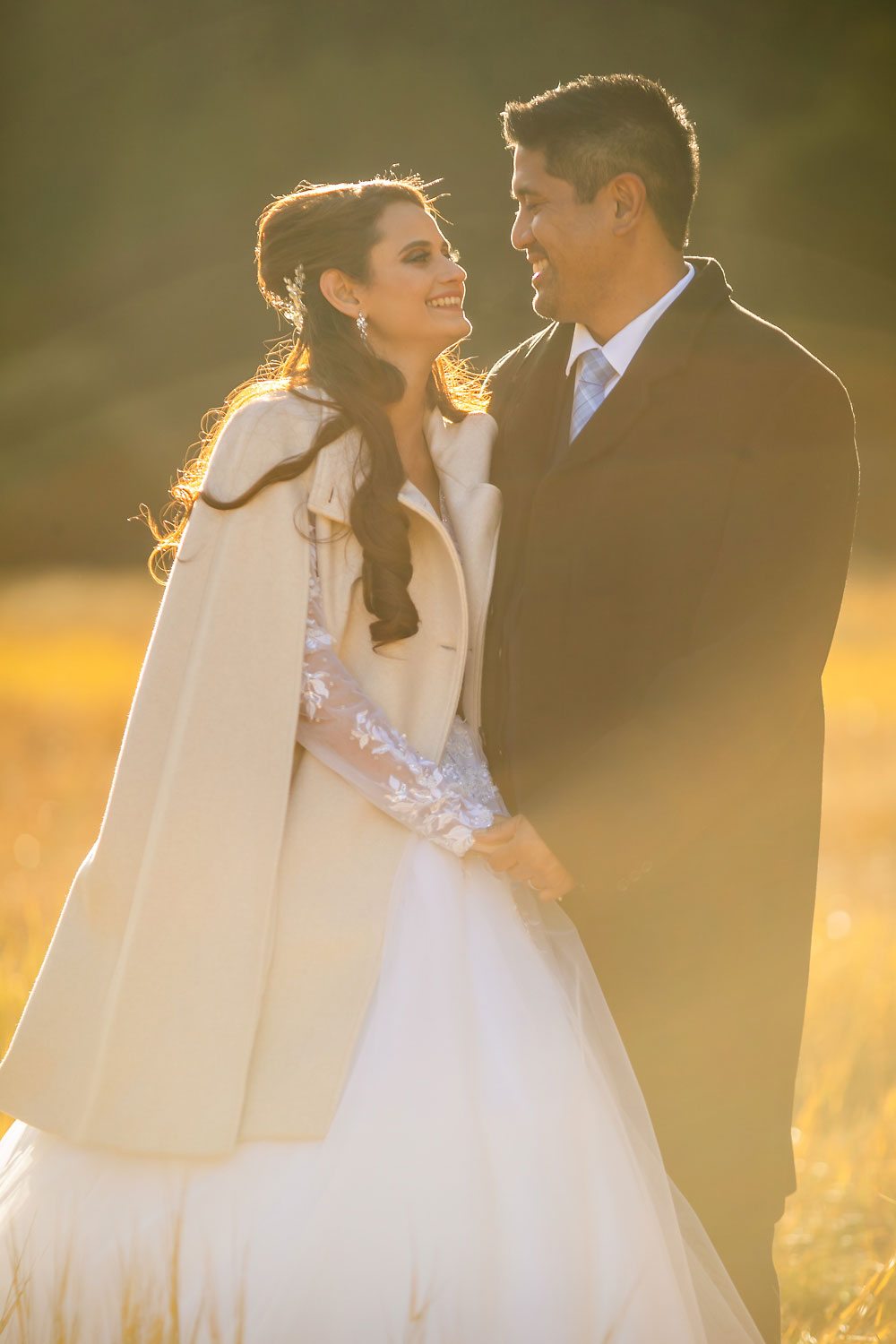 Mixed wedding couple in golden light.